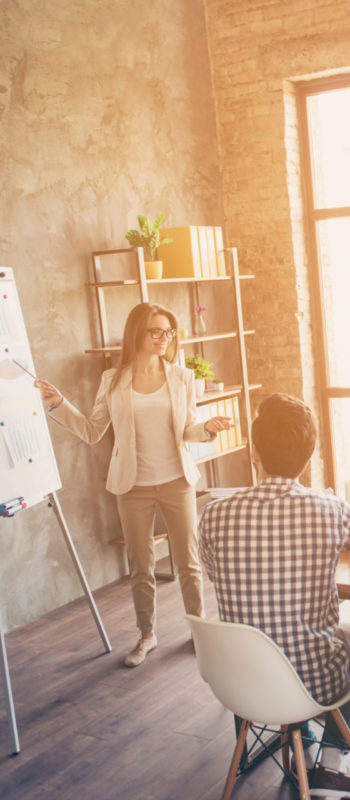 Young smart lady in glasses is reporting to the team of colleagu